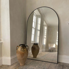 Large arched mirrors add an artistic touch to your home.