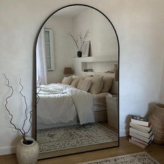 Large arched mirrors add an artistic touch to your home.
