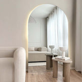 Large arched mirrors with LED add an artistic touch to your home.