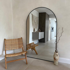 Large arched mirrors add an artistic touch to your home.