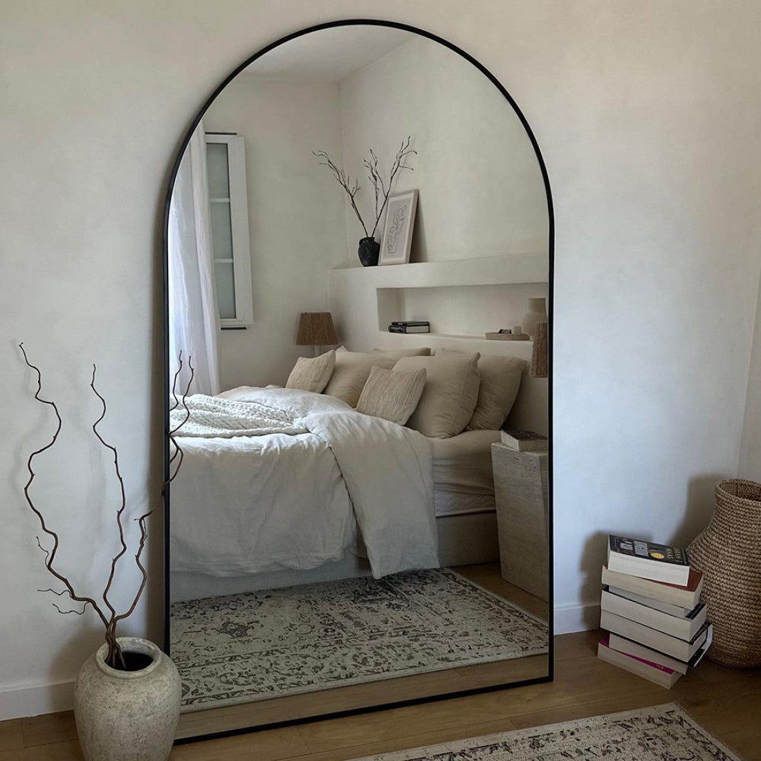 Large arched mirrors add an artistic touch to your home.